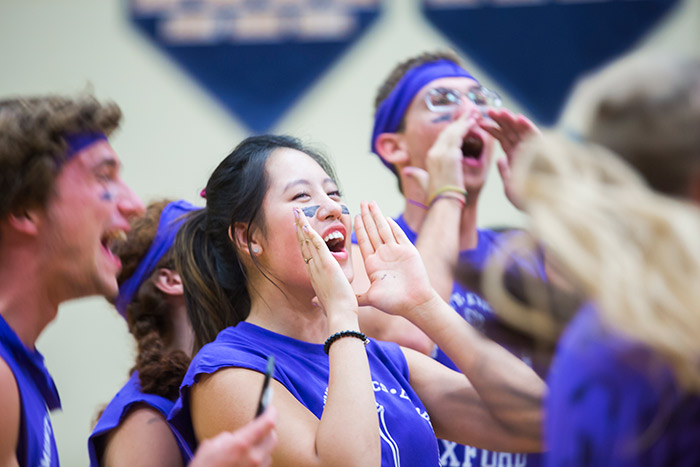 Oxford College students wear spirited face paint and cheer on their teammates at the Oxford Olympics.