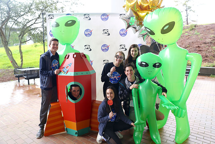 Students pose for photos at Dooley's Week events.