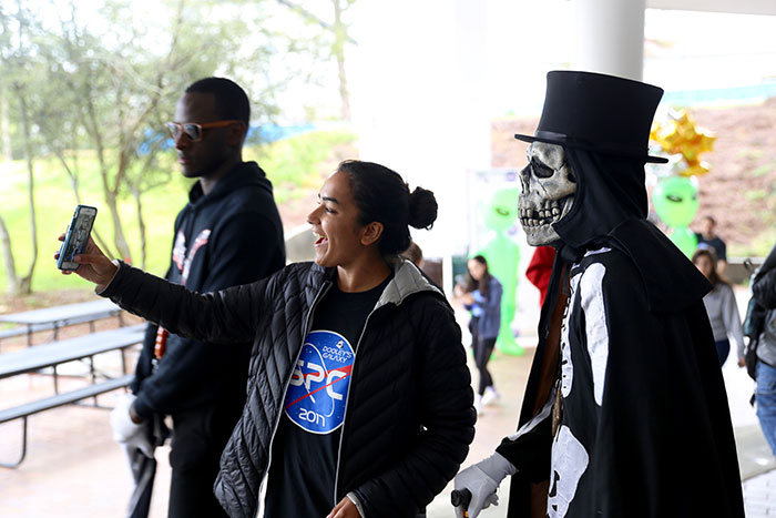 Students pose with Dooley at Dooley's Week events.