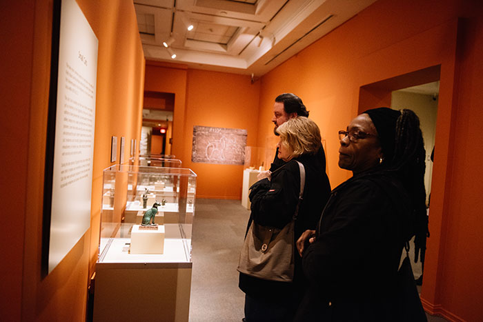 Members of the Emory community look at items in the gallery