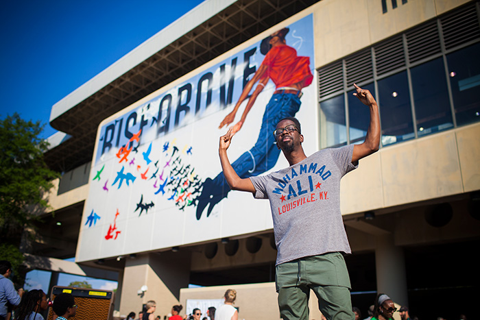 fahamu pecou in front of art work at marta station