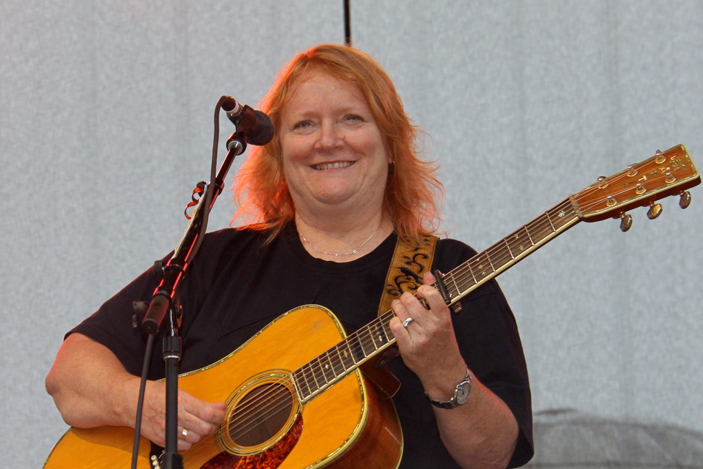 Emily Saliers smiling with guitar