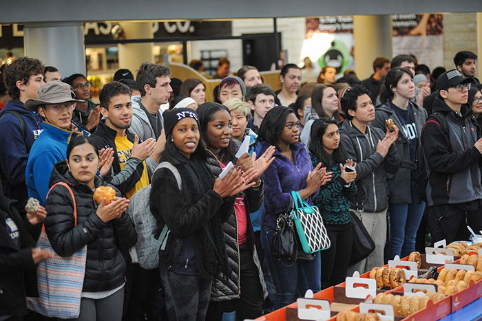 Emory students gathered in the DUC before boarding buses to head out for a full day of community service at 15 different projects.