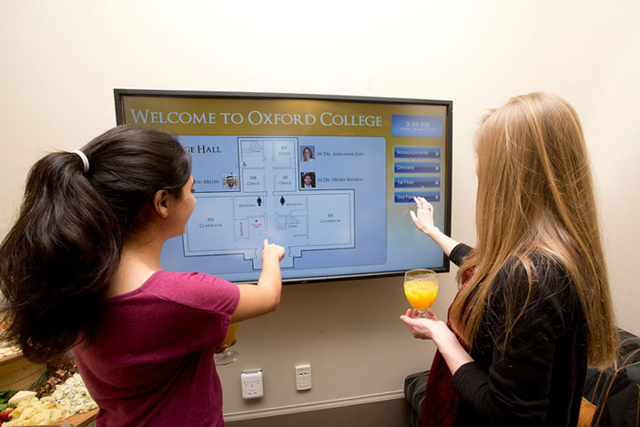 In the first-floor entry, a flat-screen monitor provides visitors with building and campus directories with touch technology.