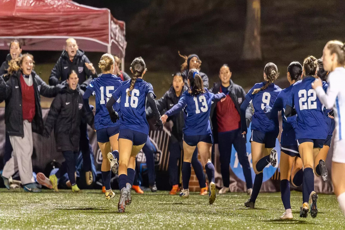 Women's soccer team celebrates after winning their Final Four match to advance to the national championship