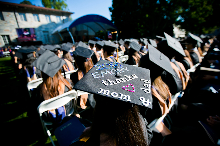 A graduate decacorated her mortarboard with Thank You Mom and Dad. 