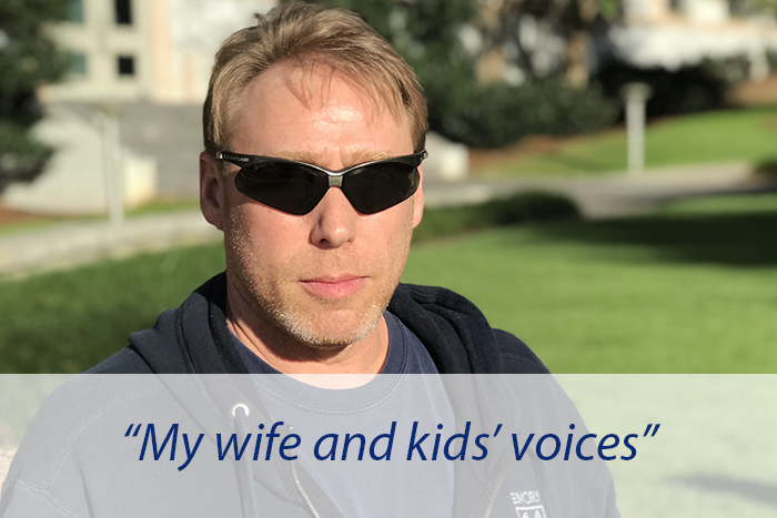 An Emory community member poses and explains that he'd most miss the sound of his children's voices.