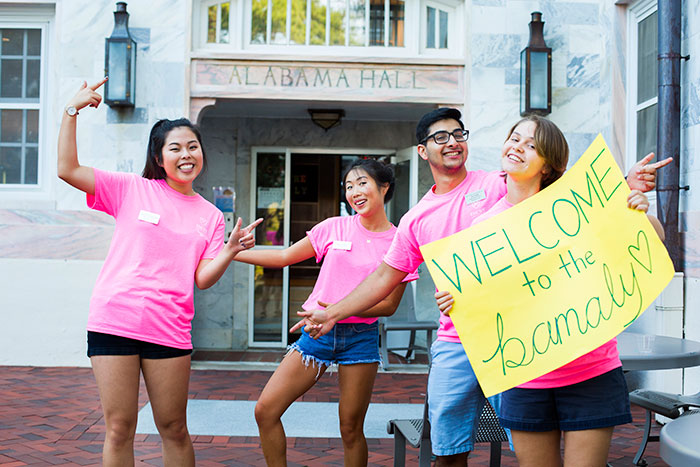 Student volunteers greet new Emory students moving into Alabama Hall.