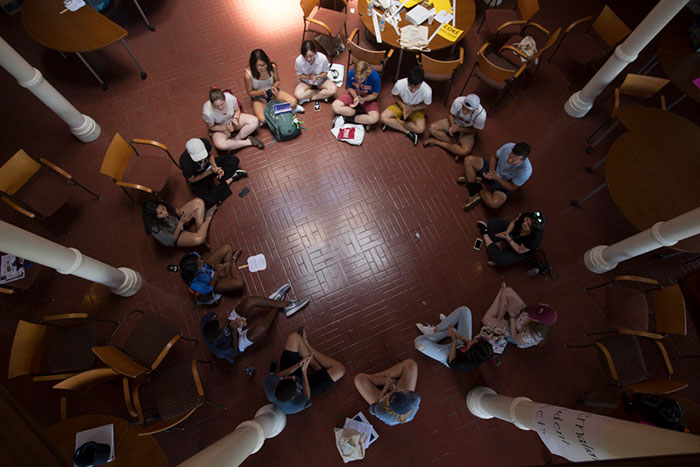 Students sit in a circle on Move-In Day.