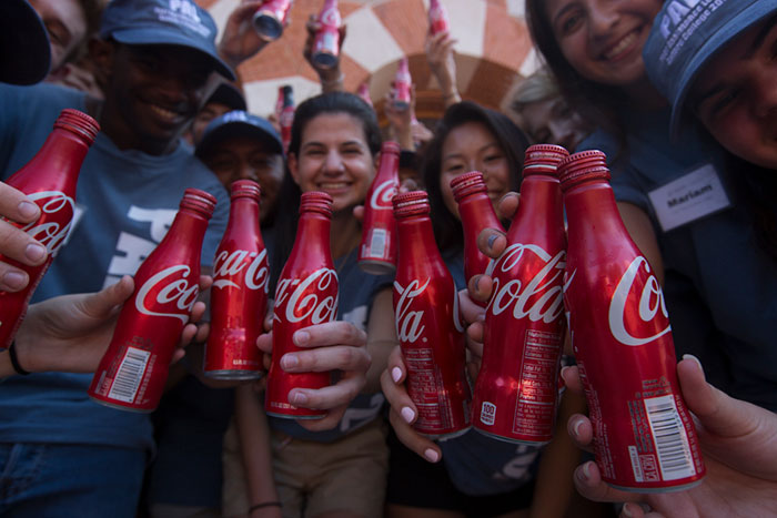 Students raise a coke for the Coke Toast.