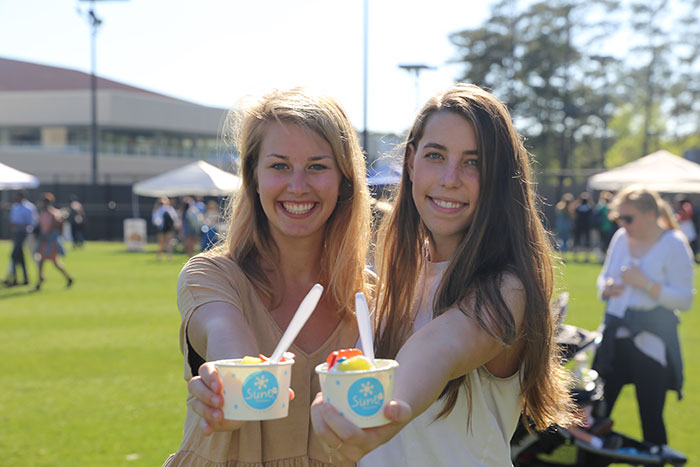 Students pose for photos at Dooley's Week events.