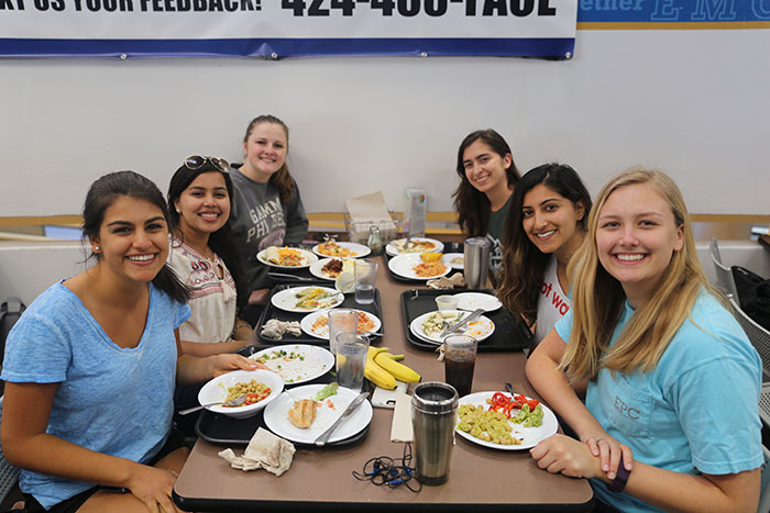 Students eat and socialize at the farewell dinner for Dobbs Market on April 25.