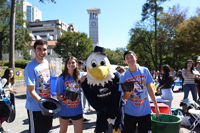 Students pose with Swoop, the Emory Athletics mascot, in matching Homecoming 2017 t-shirts.