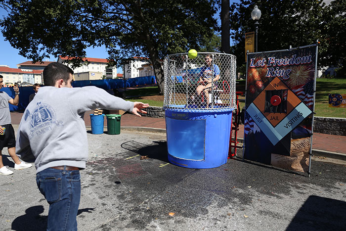 Students dunk each other at a dunking booth.