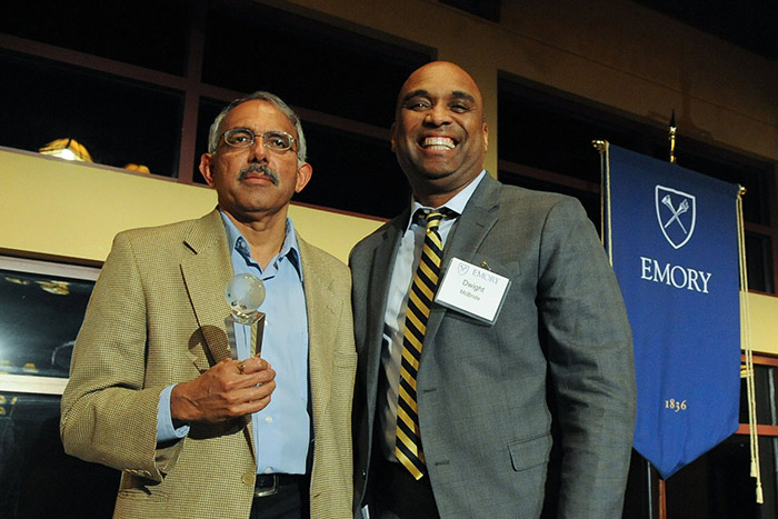 Emory Provost Dwight McBride congratulates K.M. Venkat Narayan, director of the Emory Global Diabetes Research Center, who received the Marion V. Creekmore Award for Internationalization.