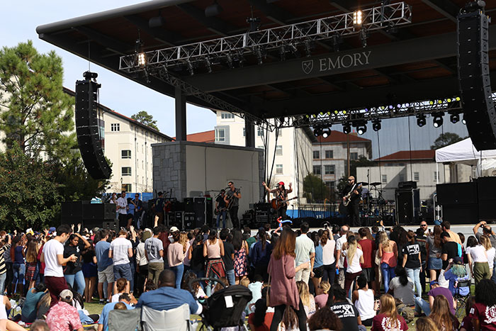 Several members of the Emory community gather close to the stage at the 2017 homecoming concert as the Plain White T's perform on stage.