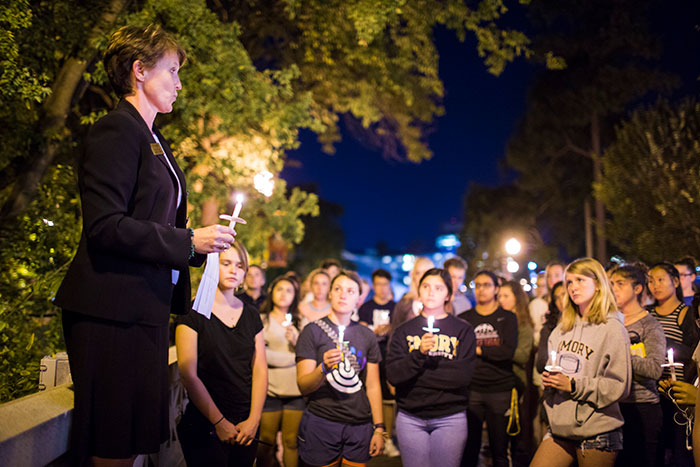An Emory community member leads discussion at the Oct. 4 candlelight vigil.