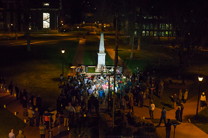 Professors Bobbi Patterson and Eloise Carter lit a flame at Few Monument representing the lamp of learning. 