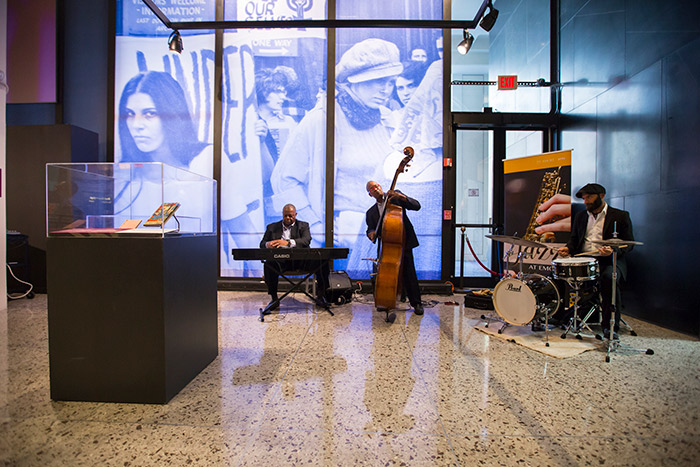 The Gary Motley Trio -- composed of pianist, Gary Motley; a bassist; and a percussionist -- performs during the opening of "The Dream Machine."