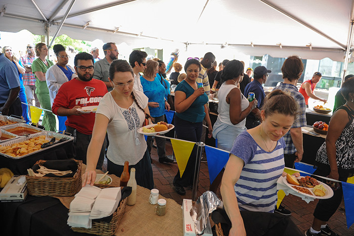 Staff members are served food at the 2017 Staff Fest.