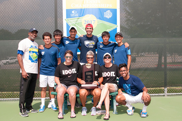 Emory's Oxford College men's tennis team stands proudly on the tennis court following its third-consecutive NCAA Division III Championship.