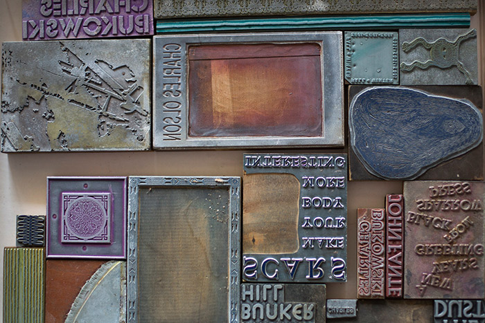 Several original printing blocks of various colors and conditions.