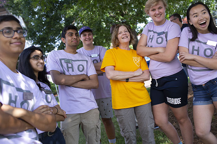 Emory President Claire E. Sterk poses with a group of student volunteers