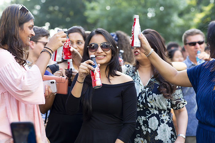 Students hold up various cokes for the Coke Toast