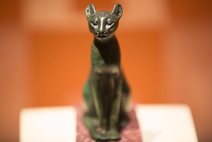A small sculpture of a cat on display at the exhibit