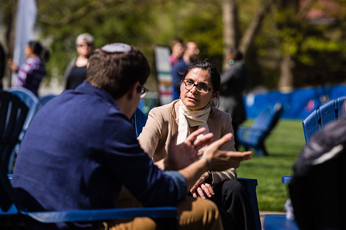Two Emory community members sit and chat at the first Conversations on the Quad.
