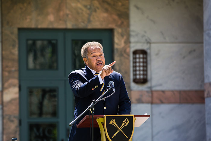 Robert M. Franklin Jr., Senior Adviser of the President, speaks at a podium at the first Conversations on the Quad