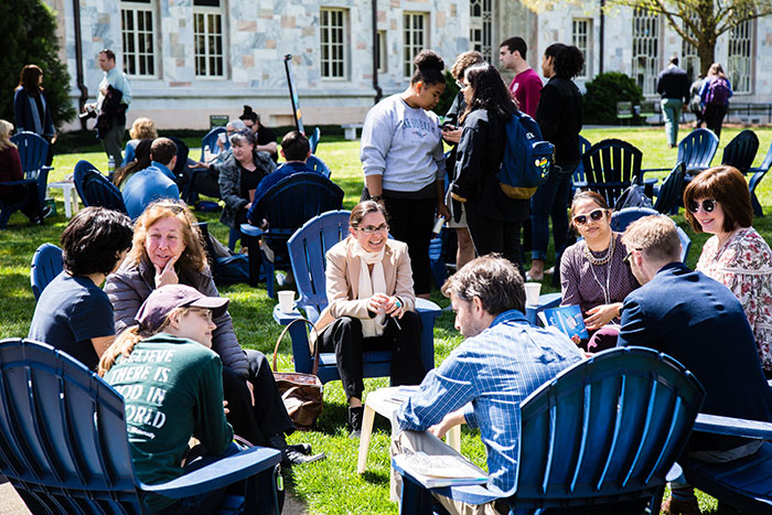 Eight Emory community members sit gathered in a circle at the first Conversations on the Quad
