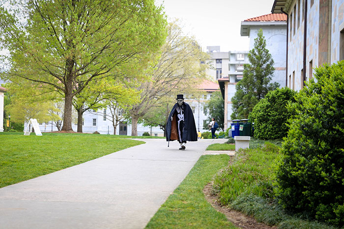 Dooley walks through campus with her cane