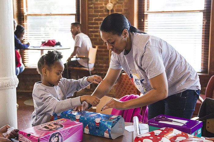 Students help wrap gifts