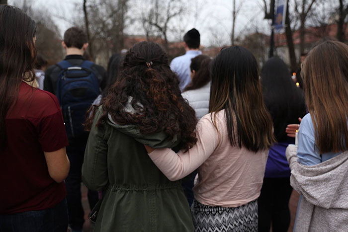 Students embrace at the student vigil for victims of the shooting in Parkland, Florida