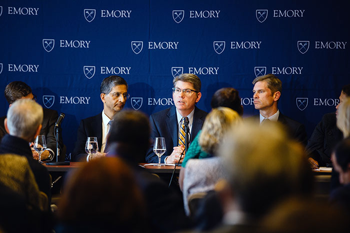 Douglas A. Hicks, dean of Oxford College (center), addresses the group as Vikas P. Sukhatme, dean of the Emory School of Medicine (left), and Michael Elliott, dean of Emory College, look on.