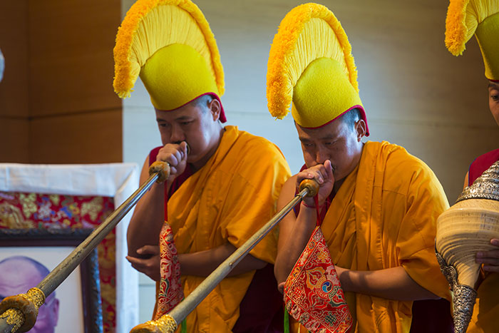 Two monks of the Drepung Loseling Monastery of Atlanta play traditional musical instruments