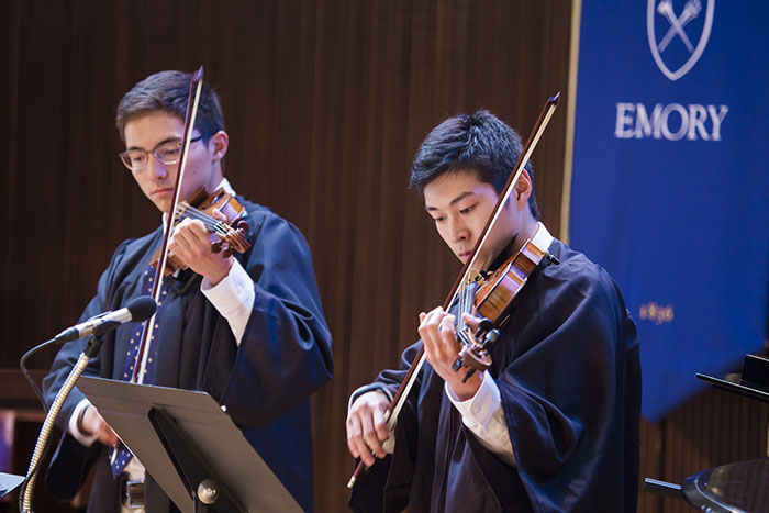 Student musicians play violins