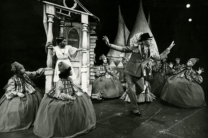 Holder, in a suit and top hat, gives direction at a rehearsal of "The Wiz."