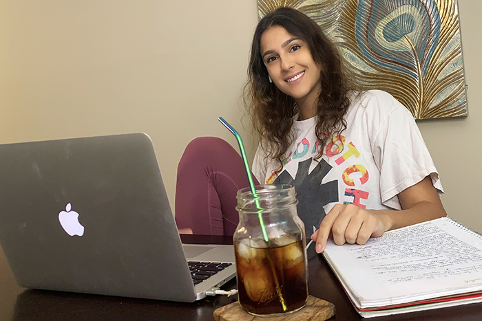 Sofia Garcia-Arias sits in front of a laptop