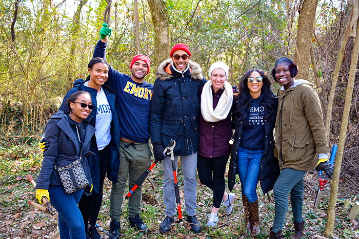 Students pose while gardening for the MLK Day of Service