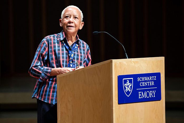 Nikki Giovanni speaks to the crowd from behind a podium