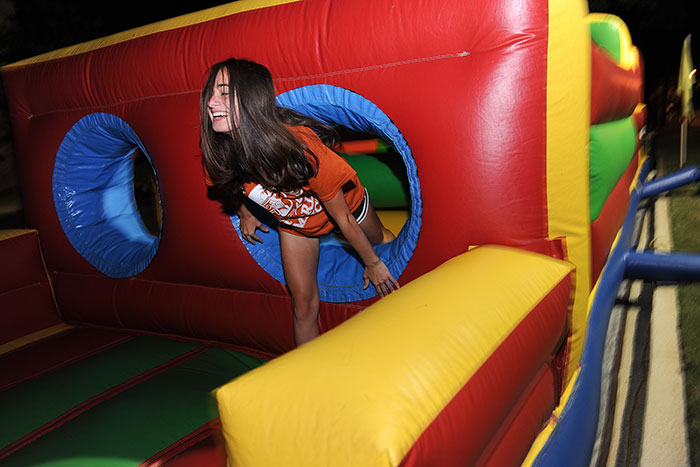 A student plays in an inflatable playhouse at the Oxford Olympics
