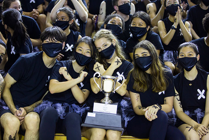 Students from Complex hold up the 2019 trophy