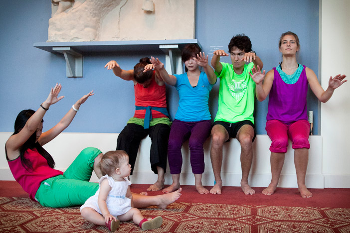 Lori Teague, director of Emory's dance program (second from left), and students perform improv dance. (The baby is the daughter of Ariel Fristoe, the 2012 Community Impact Artist Award recipient.)