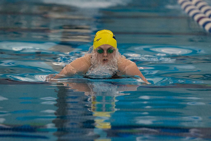 woman swimmer competes in breaststroke
