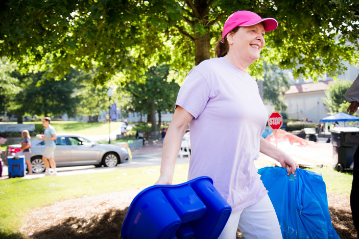 Emory Provost Claire Sterk steps in to help move students into Emory residence halls.