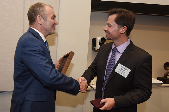 Walter J. Curran, Jr. (left) receives the 2017 Distinguished Alumnus in Professional Achievement by the Medical College of Georgia in Augusta. (Photo: Phil Jones, Augusta University)