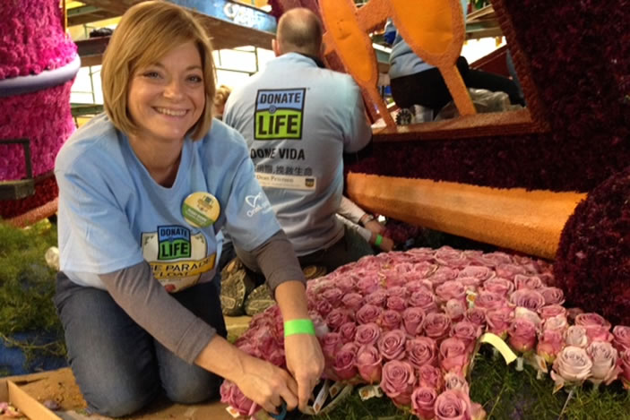 Emory islet cell transplant recipient Julie Allred decorates the Donate Life float in Pasedena on New Year's Eve.