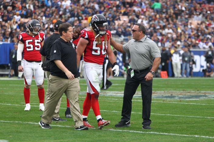 Emory physicians on the field with Atlanta Falcons players